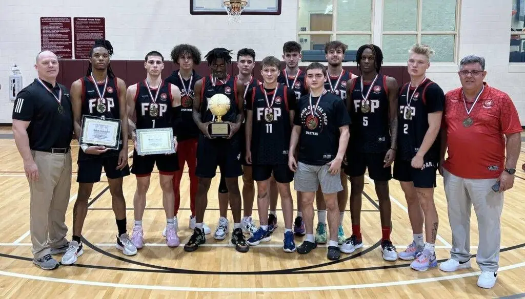 Holiday Hoops Classic champions with their trophy